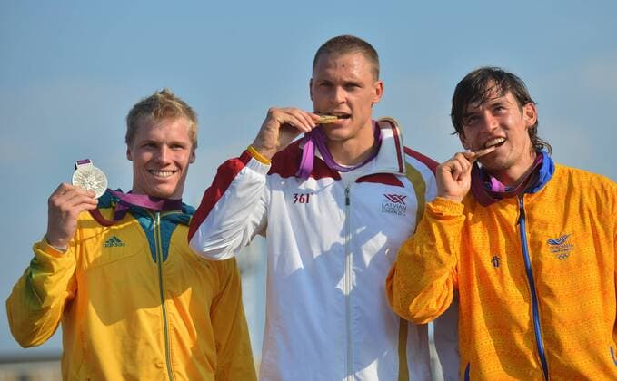 LONDON, Aug. 10, 2012 - Gold medalist Maris Strombergs of Latvia (C), silver medalist Sam Willoughby of Australia (L) and bronze medalist Carlos Mario Oquendo Zabala of Colombia attend victory ceremony of men s cycling BMX competition, at London 2012 Olympic Games in London, Britain, on August 10, 2012. (OLY2012)BRITAIN-LONDON-CYCLING BMX-MEN S BMX 