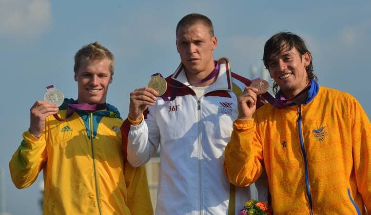LONDON, Aug. 10, 2012 - Gold medalist Maris Strombergs of Latvia (C), silver medalist Sam Willoughby of Australia (L) and bronze medalist Carlos Mario Oquendo Zabala of Colombia attend victory ceremony of men s cycling BMX competition, at London 2012 Olympic Games in London, Britain, on August 10, 2012. (OLY2012)BRITAIN-LONDON-CYCLING BMX-MEN S BMX 