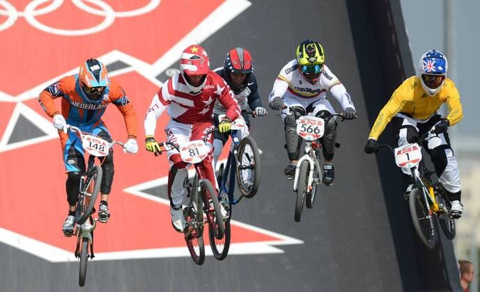 LONDON, Aug. 10, 2012 - Gold medalist Maris Strombergs of Latvia (2nd L), silver medalist Sam Willoughby of Australia (1st R) and bronze medalist Carlos Mario Oquendo Zabala of Colombia (2nd R) compete in men s cycling BMX competition, at London 2012 Olympic Games in London, Britain, on August 10, 2012. (OLY2012)BRITAIN-LONDON-CYCLING BMX-MEN S BMX 