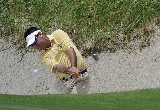 Rich Beem blasts from the bunker at hole 18 during the second round of the PGA Golf Herren Championship on August 10, 2012 at the Ocean Course in Kiawah Island, South, Carolina. Beem has a combined 4-over-par through two rounds.  SCP20120810118