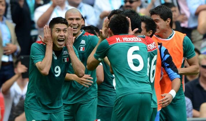 Mexican players (Oribe Peralta 9 and Hector Herrera 6) celebrate the second goal during men s football final match between Brazil and Mexico, at London 2012 Olympic Games in London, Britain, on August 11, 2012. Mexico won the match 2-1 (OLY2012)BRITAIN-LONDON-MEN S FOOTBALL-GOLD 