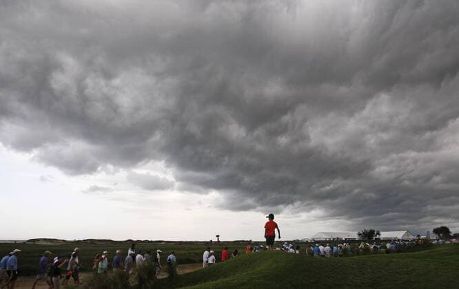 Aug. 11, 2012 - Kiawah Island, SC, USA - Golf fans head for cover after a weather warning forces a delay in play during the third round of the 2012 PGA Golf Herren Championship at the Ocean Course on Kiawah Island, South Carolina, on Saturday, August 11, 2012. PGA Golf Herren Championship, 3rd round - ZUMAm67
