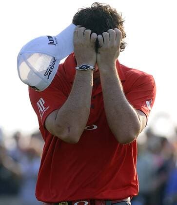An emotional Rory McIlroy of Northern Ireland holds his head in his hands after his 8-stroke victory in the final round of the PGA Golf Herren Championship on August 12, 2012 at the Ocean Course in Kiawah Island, South, Carolina.  SCP20120812128