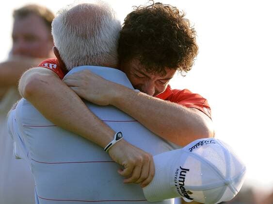 An emotional Rory McIlroy of Northern Ireland hugs his father Gerry after McIlroy s 8-stroke victory in the final round of the PGA Golf Herren Championship on August 12, 2012 at the Ocean Course in Kiawah Island, South, Carolina.  SCP20120812127