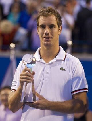 Richard Gasquet of France poses with the trophy during the awarding ceremony after the final match of the Toronto Masters tennis tournament in Toronto, Canada, on Aug. 12, 2012. 