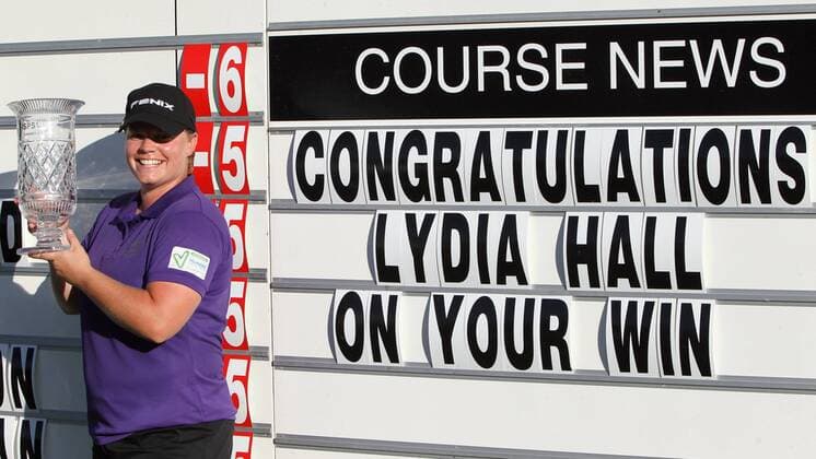 18.08.2012. Denham, Buckinghamshire, England. British Masters Champion Lydia Hall of Wales infront of the final scoreboard with the winner s trophy after the third and final round of the ISPS Handa Ladies British Masters event at The Buckinghamshire Golf Club, Denham, Greaater London - Saturday 18th August 2012 xActionplusxOperationsx  ActionPlus20140500