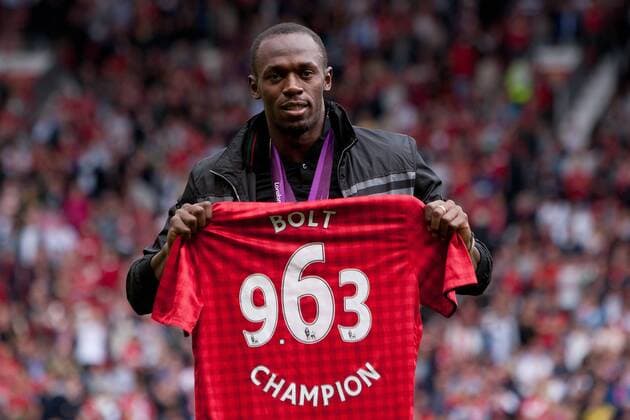 Football - Premier League; Manchester United (ManU) - Fulham FC; Jamaican sprinter Usain Bolt poses for photographs with his medals at Old Trafford 