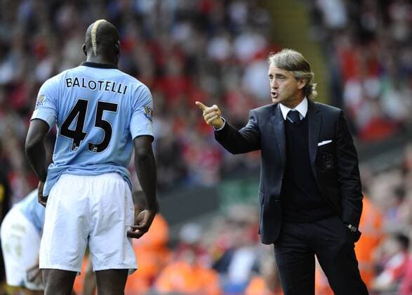 Roberto Mancini manager of Manchester City points at Mario Balotelli of Manchester City.Barclays Premier League match between.Liverpool v Manchester City at Anfield, Liverpool on the 26th August 2012.Pic Simon Bellis Sportimage EDITORIAL USE ONLY. No use with unauthorised audio, video, data, fixture lists, club league logos or live services. Online in-match use limited to 120 images, no video emulation. No use in betting, games or single club league player publications.