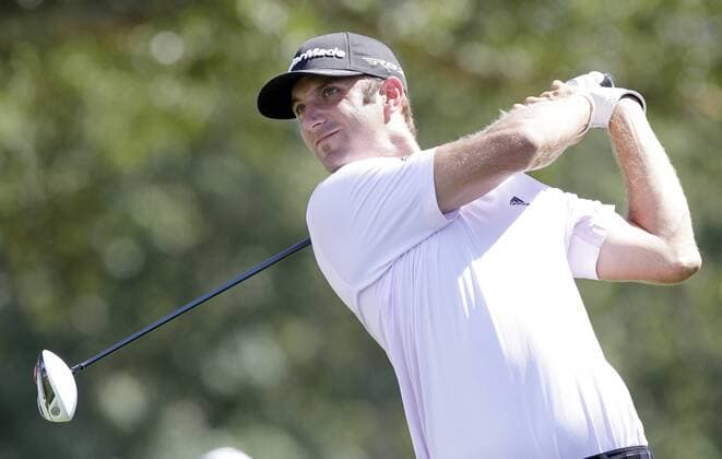 Dustin Johnson hits a tee shot on hole 10 in the final round of The Barclays 2012 FedExCup Playoffs at The Black Course at Bethpage State Park in Farmingdale, New York on August 26, 2012.  NYP20120826112
