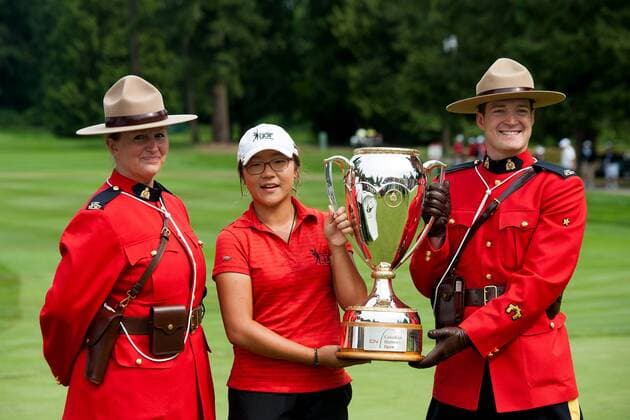 Aug. 26, 2012 - Coquitlam, British Columbia, Canada - LYDIA KO holds up the trophy along with two RCMP mounties after winning the 2012 CN Canadian Women s Open at the Vancouver Golf Club on August 25, 2012 in Coquitlam, British Columbia, Canada. Golf 2012 - Fouth round of Canadian Women s Open  - ZUMAl10