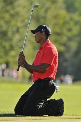 03 September 2012:Tiger Woods drops to his knees after just missing his chip in his shot on the 15th hole during the Deutsche Bank Championship at TPC Boston in Norton, MA Editorial Use Only GOLF: SEP 03 PGA Golf Herren - Deutsche Bank Championship- Final Round Icon147120903042 EDITORIAL USE ONLY