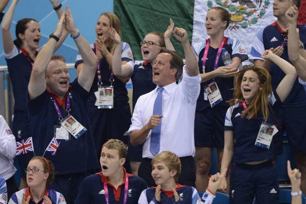 British Prime Minister David Cameron (C) cheers during women s 200m individual medley - SM6 final at London 2012 Paralympic Games, in London, Britain, on Sept. 3, 2012. 