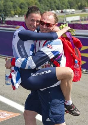 Sarah Story Paralympics Cyclist is hugged by her husband Barney with her gold Medal at Brands Hatch, during the London 2012, Paralympics, Wednesday September 5, 2012. i-Images 