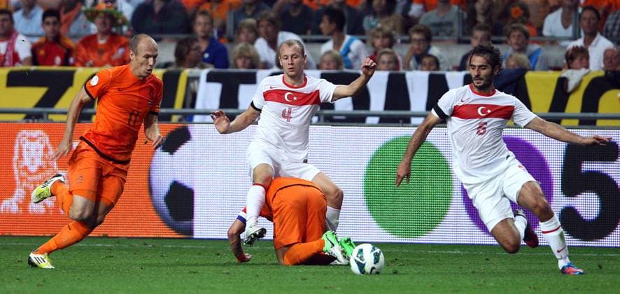 World Cup Qualifier between Holland and Turkey at the Amsterdam Arena on September 07, 2012 in Amsterdam, Holland. Pictured: Arjen Robben (L) and Wesley Sneijder (C below) of Holland and Semih Kaya (C up) and Hamit Altintop (R) of Turkey. 