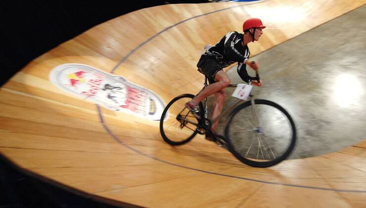 (120909) -- VANCOUVER, Sept. 9, 2012 (Xinhua) -- A cyclist competes at the Canadian edition of Red Bull Mini Drome on Sept. 8, 2012 in Vancouver, Canada. Red Bull Mini Drome is unique Fixed Gear Event, where cyclists take their street skills to the track in a test of mental stamina, technical precision and raw strength. Red Bull Mini Drome brings skill, speed, balance, and bravado together on a steep and shrunken version, far from the traditional velodrome, to give competitors the most challenging and treacherous ride of their lives. (Xinhua Sergei Bachlakov) CANADA-VANCOUVER-CYCLING 