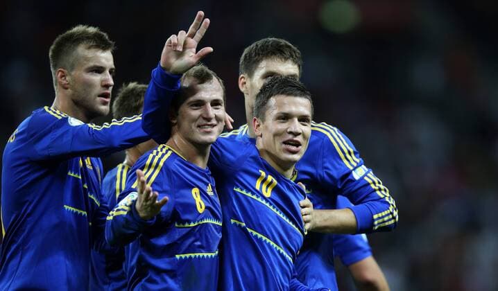 LONDON, Sept. 11, 2012 -- Yevhen Konoplianka of Ukraine (front R) celebrates scoring with team mates Roman Zozulya (2nd L) and Yevhen Selin (L) during the FIFA 2014 World Cup Group H qualifying match between England and Ukraine at Wembley Stadium in London, Britain, on Sept. 11, 2012. The match ended with a 1-1 draw. (Xinhua Wang Lili) BRITAIN-LONDON-SOCCER-WORLD CUP QUALIFIER-ENG VS UKR 
