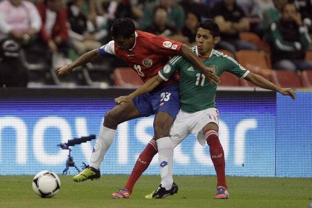 MEXICO CITY, Sept. 11, 2012 - Mexico s Javier Aquino (R) vies with Costa Rica s Pedro Leal during their 2014 World Cup qualifying soccer match at Azteca stadium, in Mexico City, capital of Mexico, on Sept. 11, 2012. (Xinhua Rodrigo Oropeza) (ro) (da) (py) MEXICO-MEXICO CITY-SOCCER-FIFA WORLD CUP QUALIFIER-MEXICO VS COSTA RICA 