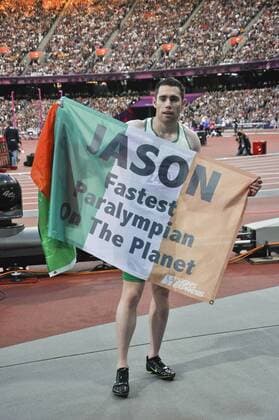 Sep. 06, 2012 - London, England, Great Britian - JASON SMYTH (IRL) after winning the gold medal for the Men s 100M T13, holds up the flag of Ireland at the 2012 Paralympic Games. Paralympics 2012 - Athletics - ZUMAw11