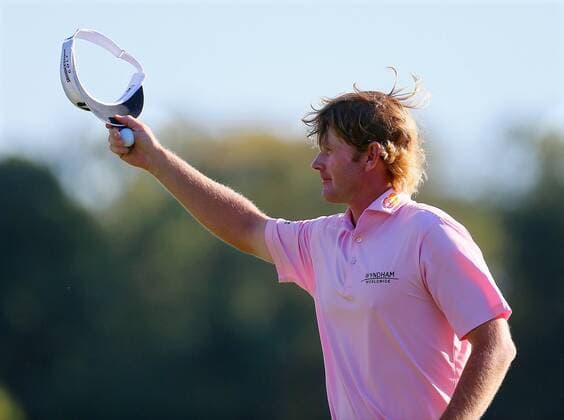 Sept. 23, 2012 - Atlanta, GA, USA - Brandt Snedeker tips his cap to the cheering gallery after chipping it in the hole for a birdie to go 11-under par on the 17th green to win the Tour Championship and FedExCup at East Lake Golf Club in Atlanta, Georgia, on Sunday, September 23, 2012. Snedeker finished his round at 10-under par for a three stroke victory over Justin Rose to take home both trophies. Tour Championship - ZUMAm67