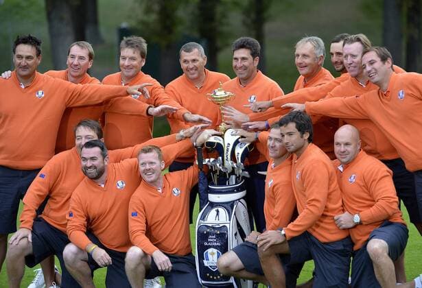 Team Europe captain Jose Maria Olazabal of Spain (C) poses with the Ryder Cup and the players caddies before the start of the 39th Ryder Cup at Medinah Country Club on Tuesday, September 25, 2012 in Medinah, Illinois. Ryder Cup play begins Friday.  BKX2012092505