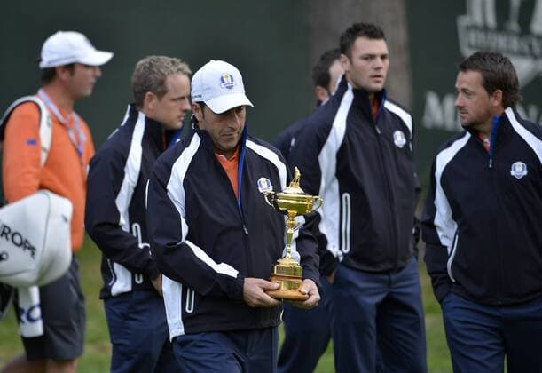 Team Europe captain Jose Maria Olazabal of Spain walks out for the team photo holding the Ryder Cup Trophy before the start of the 39th Ryder Cup at Medinah Country Club on Tuesday, September 25, 2012 in Medinah, Illinois.  BKX2012092506
