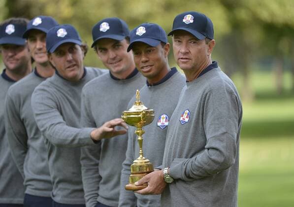 United States Ryder Cup team captain Davis Love III (R), holds the Ryder Cup as he poses with teammates Tiger Woords, Keegan Bradley and Phil Mickelson at the 39th Ryder Cup at Medinah Country Club on Tuesday, September 25, 2012 in Medinah, Illinois. Ryder Cup tournament play begins Friday.  BKX2012092546