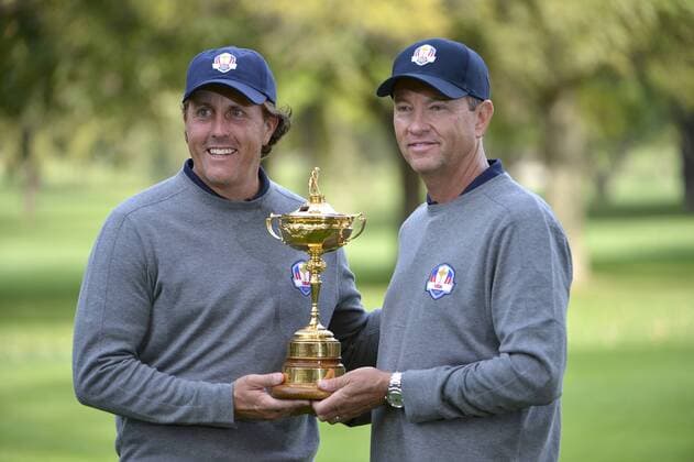 United States Ryder Cup team captain Davis Love III (R) and Phil Mickelson pose for photos at the 39th Ryder Cup at Medinah Country Club on Tuesday, September 25, 2012 in Medinah, Illinois. Ryder Cup tournament play begins Friday.  BKX2012092549