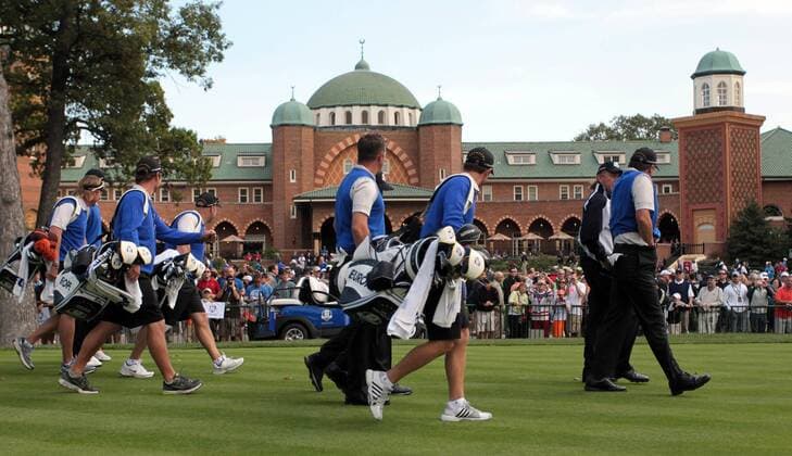 European team members led by Lee Westwood (C) walk past the clubhouse during the second day of practice rounds at Medinah Country Club, site of the 39th Ryder Cup matches September 26, 2012 in Medinah, Illinois.  MED2012092664