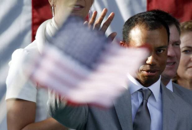 Tiger Woods, of Team USA, waves as he is introduced to the crowd during opening ceremonies for the Ryder Cup at the Medinah Country Club in Medinah, IL on September 27, 2012. Team USA takes on team Europe to try and win back the cup after a loss in 2010.  MED2012092710