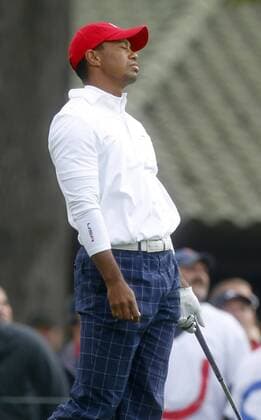 Team USA s Tiger Woods reacts to his tee shot on the 15th hole at the 39th Ryder Cup at Medinah Country Club on September 28, 2012 in Medinah, Illinois.  MED2012092805