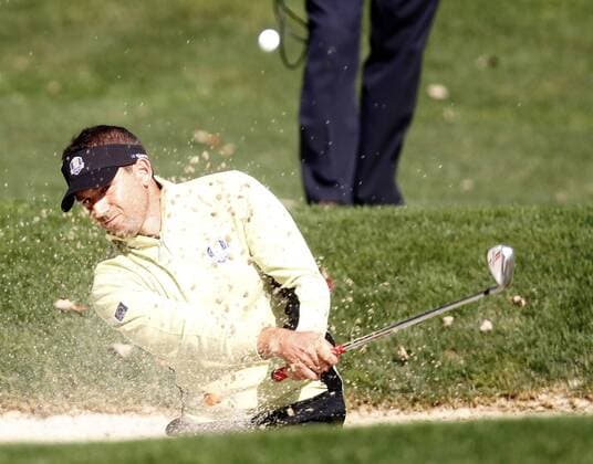 Team Europe s Sergio Garcia of Spain chips out of a bunker onto the 14th green at the 39th Ryder Cup at Medinah Country Club on September 28, 2012 in Medinah, Illinois.  MED2012092807