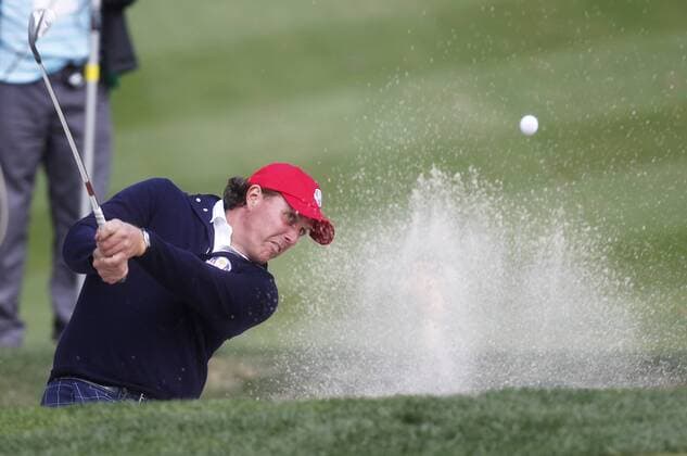 Team USA s Phil Mickelson chips out of a bunker on the 14th green at the 39th Ryder Cup at Medinah Country Club on September 28, 2012 in Medinah, Illinois.  MED2012092808