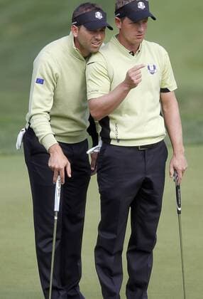 Team Europe s Sergio Garcia, of Spain, left, and Luke Donald, of England, discuss a putt on the 14th green at the 39th Ryder Cup at Medinah Country Club on September 28, 2012 in Medinah, Illinois.  MED2012092809