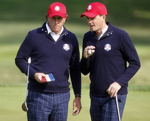 Team USA s Phil Mickelson, left, and Keegan Bradley, right, discuss a putt on the 14th green at the 39th Ryder Cup at Medinah Country Club on September 28, 2012 in Medinah, Illinois.  MED2012092810
