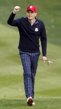 Team USA s Keegan Bradley pumps up the crowd as he walks up the 14th fairway at the 39th Ryder Cup at Medinah Country Club on September 28, 2012 in Medinah, Illinois.  MED2012092815
