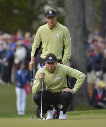 Team Europe s Luke Donald of England (back) and Sergio Garcia of Spain line up a putt on the eighth hole at the 39th Ryder Cup at Medinah Country Club on September 28, 2012 in Medinah, Illinois.  BKX2012092824