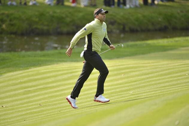 Team Europe s Sergio Garcia of Spain runs up to the 12th green to see his shot at the 39th Ryder Cup at Medinah Country Club on September 28, 2012 in Medinah, Illinois.  BKX2012092835