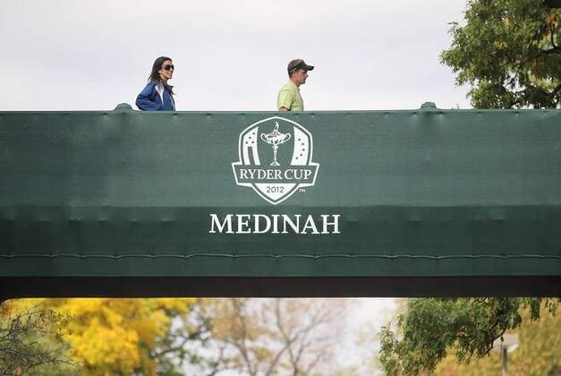Golf- Ryder Cup 2012- Friday AM Foursomes Luke Donald and wife Diane cross the player bridge near the first tee at Medinah Country Club, Chicago, USA. 