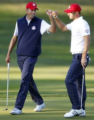 Team USA s Matt Kuchar, left, and Dustin Johnson celebrate their win over Team Europe at the 39th Ryder Cup at Medinah Country Club on September 28, 2012 in Medinah, Illinois.  MED2012092840