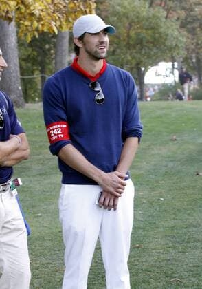 29 September, 2012: Olympic swimmer Michael Phelps takes in a round of golf on day two of Ryder Cup action during the afternoon round, at Medinah Country Club, in Medinah, IL. GOLF: SEP 29 PGA Golf Herren - Ryder Cup Icon120929376 EDITORIAL USE ONLY