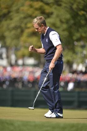 Team Europe s Luke Donald of England pumps his fist after sinking a par putt to win the second hole during the singles matches at the 39th Ryder Cup at Medinah Country Club on September 30, 2012 in Medinah, Illinois.  CHI20120930