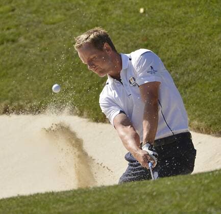 Team Europe s Luke Donald of England chips out of a bunker and onto the 17th green during the singles matches at the 39th Ryder Cup at Medinah Country Club on September 30, 2012 in Medinah, Illinois. Donald defeated Team USA s Bubba Watson 2 and 1 to win a point for Team Europe.  CHI2012093011