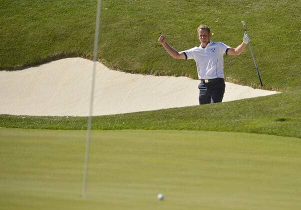 Team Europe s Luke Donald of England reacts after putting his bunker shot within a few feet of the 17th hole during the singles matches at the 39th Ryder Cup at Medinah Country Club on September 30, 2012 in Medinah, Illinois. Donald defeated Team USA s Bubba Watson 2 and 1 to win a point for Team Europe.  CHI2012093012