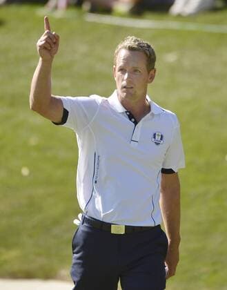 Team Europe s Luke Donald of England reacts after putting his bunker shot within a few feet of the 17th hole during the singles matches at the 39th Ryder Cup at Medinah Country Club on September 30, 2012 in Medinah, Illinois. Donald defeated Team USA s Bubba Watson 2 and 1 to win a point for Team Europe.  CHI2012093013