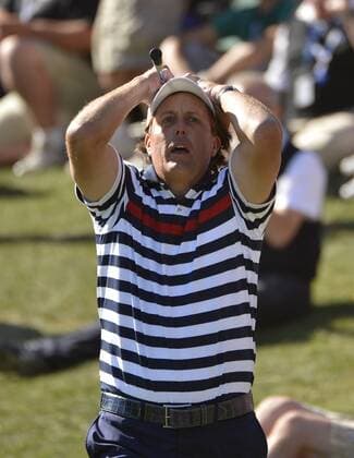 Team USA s Phil Mickelson reacts after nearly chipping in for birdie on the 17th hole at the 39th Ryder Cup at Medinah Country Club on September 30, 2012 in Medinah, Illinois. Team Europe defeated Team USA 14 1 2 to 13 1 3 points.  CHI2012093044
