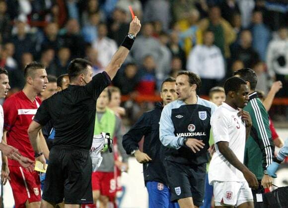 16.10.2012 Krusevac(Serbia) Serbia-England UEFA Under 21 Euro qualify play off men s football Danny Rose (R) England receive red card from Huseyin Gocek(2nd Left) Turkey referee and Sasa Markovic(L) Serbia 