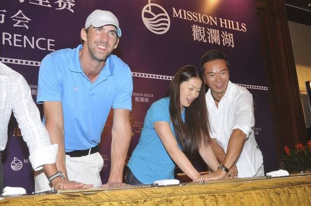 HAIKOU, CHINA - OCTOBER 18: (CHINA OUT) (L - R) Michael Phelps of USA and Chinese swimmer Luo Xuejuan attend Mission Hills Star Trophy press conference at the Mission Hills Golf Club on October 18, 2012 in Haikou, Hainan Province of China.  CFP432776875 