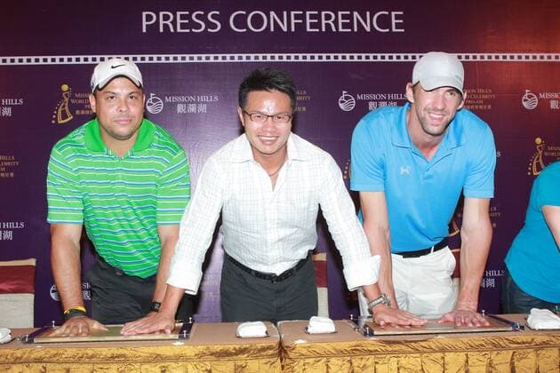 HAIKOU, CHINA - OCTOBER 18: (CHINA OUT) (L - R) Ronaldo Nazario of Brazil, Mission Hills Group Chairman Zhu Dingjian and Michael Phelps of USA attend Mission Hills Star Trophy press conference at the Mission Hills Golf Club on October 18, 2012 in Haikou, Hainan Province of China.  CFP432777433 