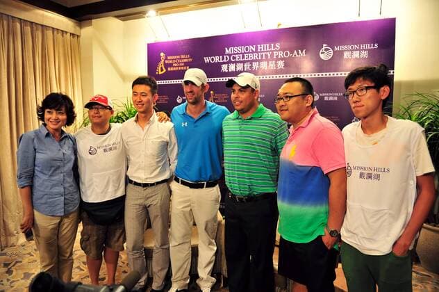 Former Brazilian soccer superstar Ronaldo, third right, US Olympic swimming champion Michael Phelps, center, and other guests attend a press conference for the 2012 Mission Hills World Celebrity Pro-Am golf tournament in Haikou city, south Chinas Hainan province, 18 October 2012. Ronaldo, Michael Phelps highlight press conference for World Celebrity Pro-Am golf tournament in Haikou  20121018_35491
