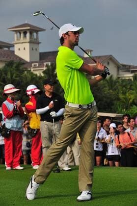 US Olympic swimming champion Michael Phelps plays a shot during the 2012 Mission Hills World Celebrity Pro-Am golf tournament in Haikou city, south Chinas Hainan province, 19 October 2012. Stars kick off World Celebrity Pro-Am golf tournament in Haikou  20121019_35526